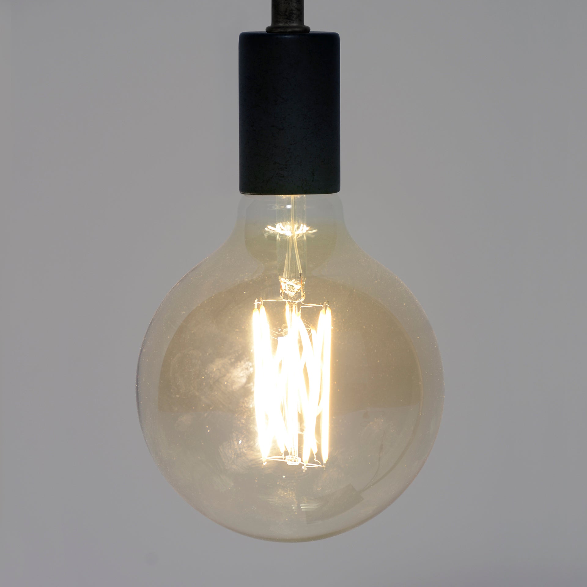 Lichtbron LED [G125] filament bol Ø12,5 - E27 6W dimbaar / Amberkleurig glas